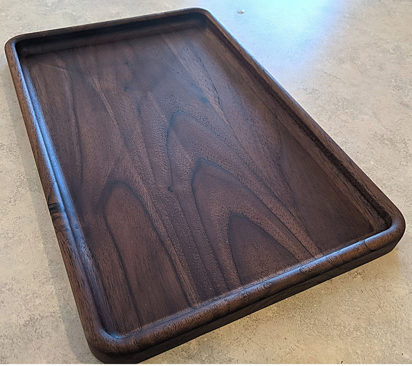 Large walnut catch-all tray 12x8 inch empty on counter highlighting natural wood grain and color