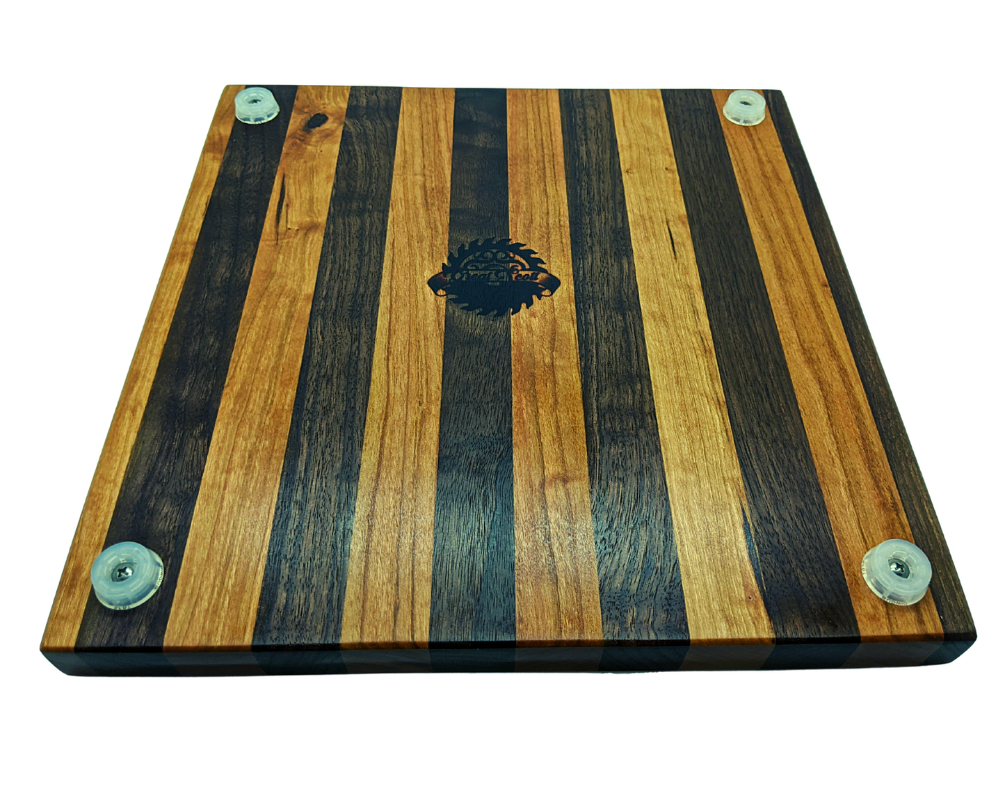 Underside view of the Walnut and Cherry cutting board showing four translucent non-slip rubber feet secured with stainless steel screws. The Great Scott Woodworks logo is centered on the bottom, surrounded by the high-contrast striped wood pattern. This view emphasizes the 1.5-inch total height and the protective clearance provided by the feet to prevent moisture buildup. Durable, professional-grade construction designed for stability on granite or tile countertops.