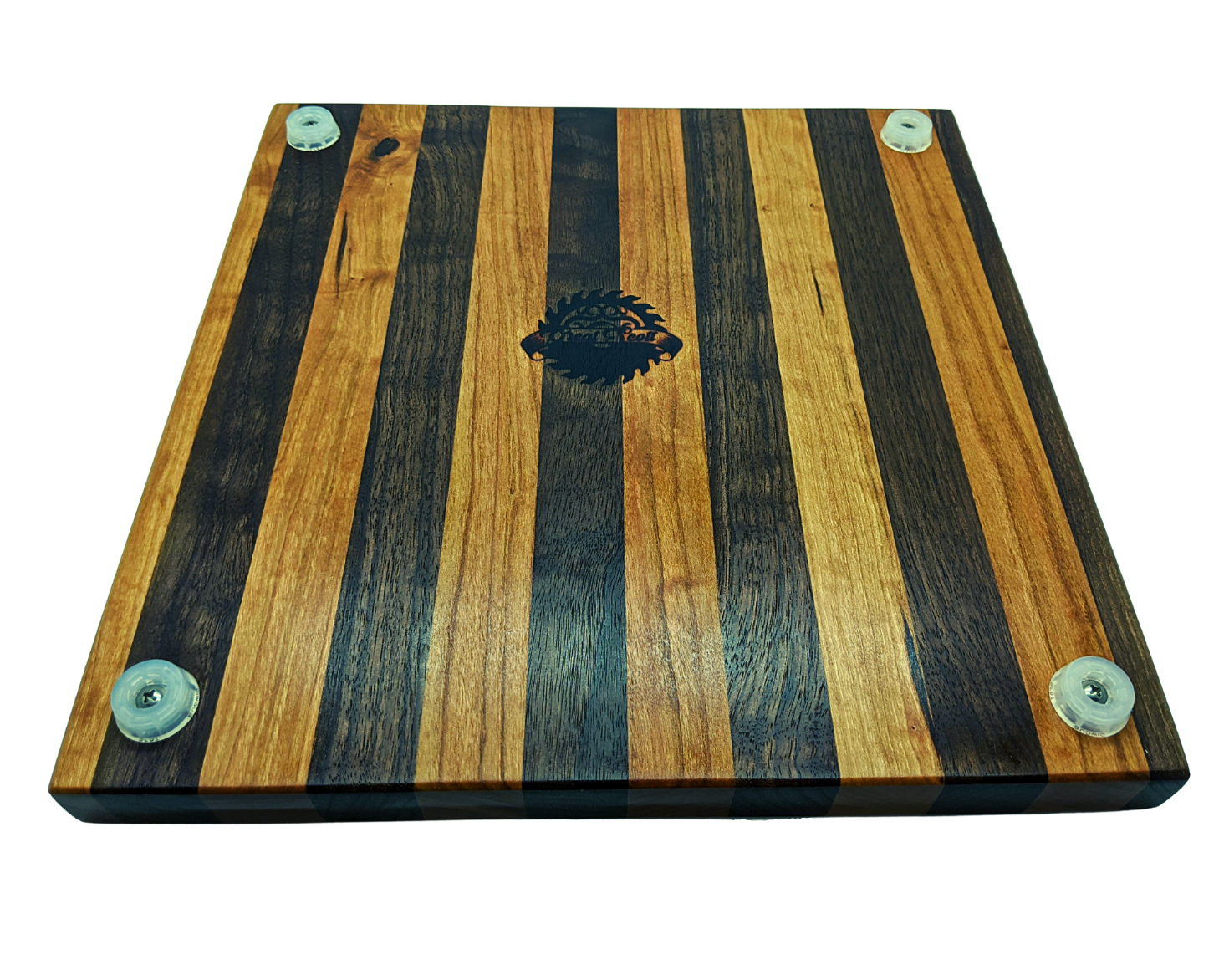 Underside view of the Walnut and Cherry cutting board showing four translucent non-slip rubber feet secured with stainless steel screws. The Great Scott Woodworks logo is centered on the bottom, surrounded by the high-contrast striped wood pattern. This view emphasizes the 1.5-inch total height and the protective clearance provided by the feet to prevent moisture buildup. Durable, professional-grade construction designed for stability on granite or tile countertops.