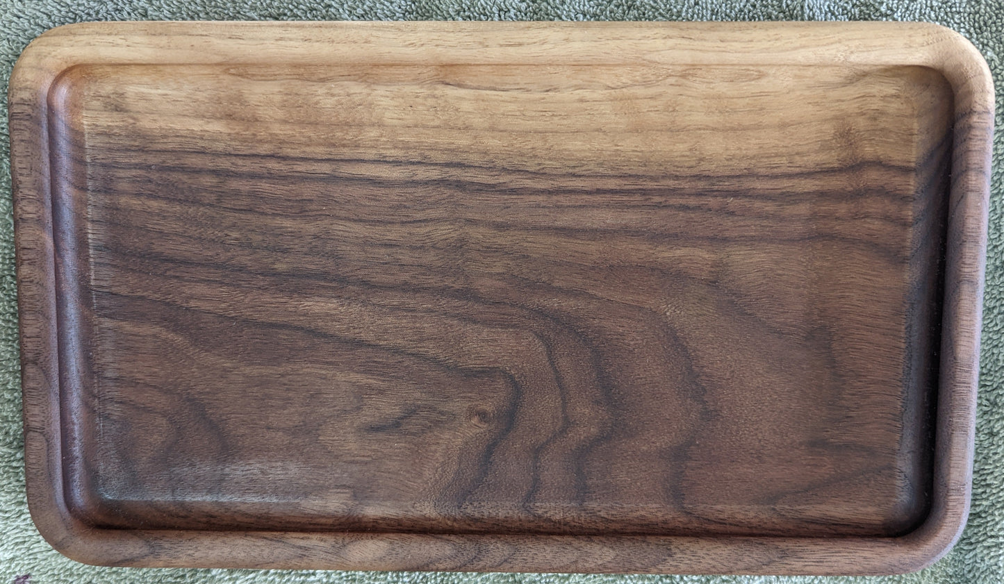 Top-down view of walnut catch-all tray showing natural color and grain variation within a single piece of wood